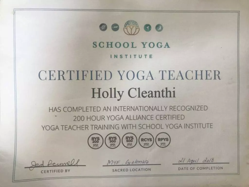 A certificate of certification for yoga teacher holly cleanthi.