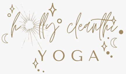 A gold and white logo for yoga studio