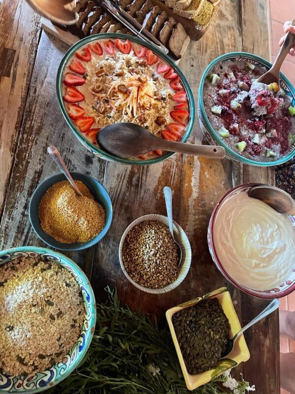A table with bowls of food and sauces.